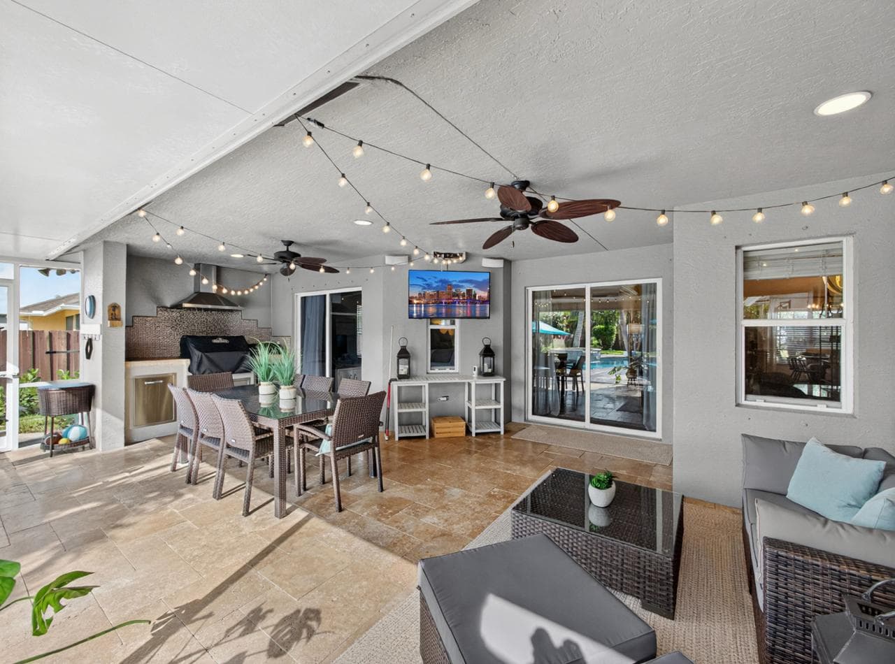 Patio lounge with outdoor TV and grill