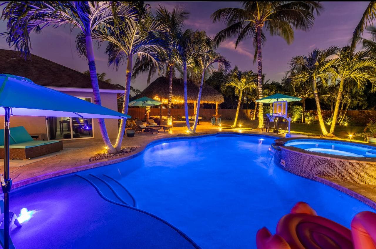 Pool and tiki at night
